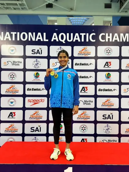 Vihita Nayana on the top of the podium for the 50m Backstroke.