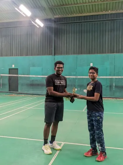 A coach presenting a trophy to a junior player for his performance during our April 2023 match day. We recognize and celebrate the achievements of our players.