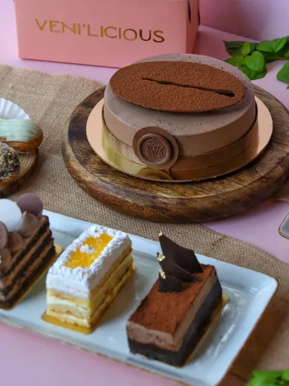 Our new menu is all set to woo you. A spread of our cakes and pastries, showcasing the variety we offer.