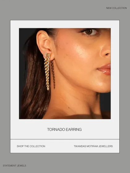 Meet my Tornado Earring, where artistry blends with gravity. This gold droplet earring spirals down in an intricate whirlwind of design, crafted for those who dare to own a unique statement piece.