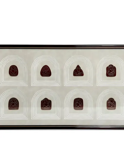 The full view of the framed Ganesha emblems. The combination of the 100% solid wooden frame and the intricate, multi-layered suede mat creates a true masterpiece that elevates the collection.