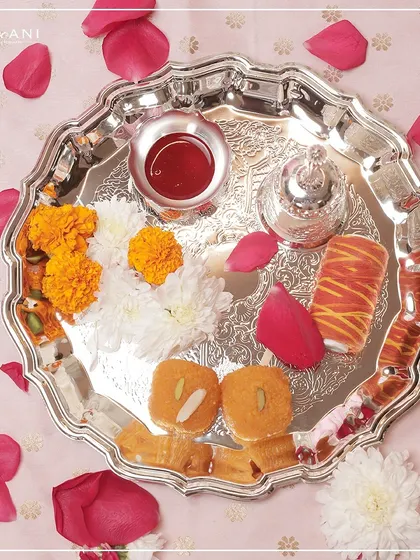 A beautifully crafted Pooja Thali from my Devaarya Collection, complete with divine offerings. Paired with sweets and flowers, this exquisite silver thali adds a touch of devotion and elegance to your festive rituals.
