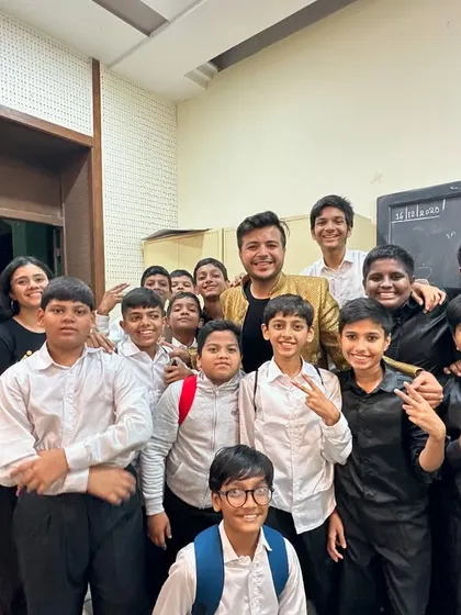 A backstage photo with some of the talented students from the 'SuperStan Musical'. The excitement and camaraderie behind the scenes are just as important as the performance itself.