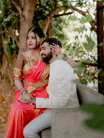 A relaxed, seated portrait. This pose allows the couple to interact naturally while I capture their connection in a comfortable and serene setting.