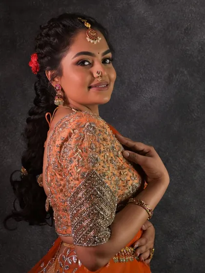 A side profile showing the pretty hairstyle and how the maang tikka sits. Every detail matters when creating the perfect look.