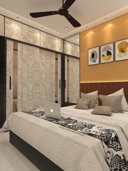 A bedroom render for a Goregaon project, featuring a warm yellow accent wall and wardrobes with a textured finish. The design is modern and cheerful, with stylish wall sconces adding to the ambiance.