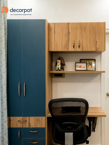 A stylish study unit for a teen's room, combining a rich blue with a natural wood finish. The wall-mounted desk saves floor space, while the open shelves are perfect for books and personal items.