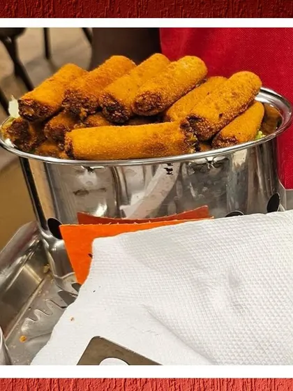 Another look at our pass-around service, featuring crispy spring rolls that are perfect for mingling guests.