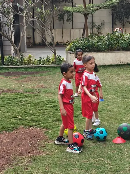Kids listen attentively to instructions before starting a drill in their apartment complex. We make sure every session is organized, safe, and packed with learning opportunities, no matter the location.