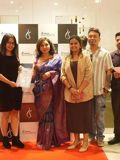 Our instructors awarding a certificate to a graduating student. We are dedicated to recognizing the hard work and talent of every person who joins our academy.