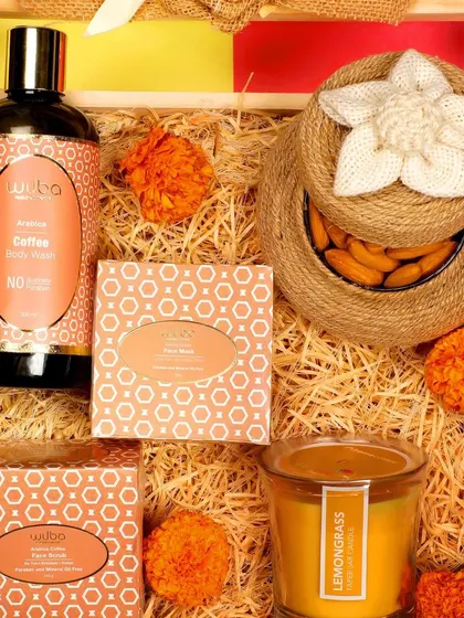 A close-up of a coffee-themed skincare set, clearly showing the product packaging and branding for a catalog.