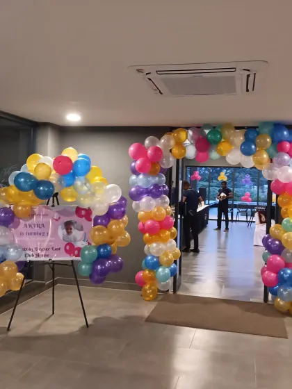 The entrance to the unicorn party featured a custom welcome sign surrounded by colorful balloons. This creates an exciting first impression for guests as they arrive.