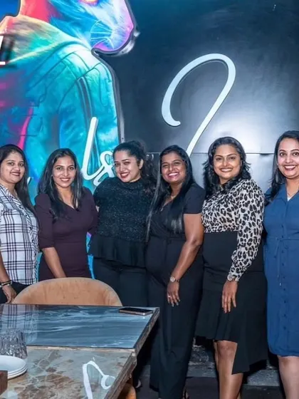 A group of ladies gathered for a table, enjoying a girls' night out at Babylonia.