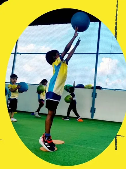 Reaching for new heights. This action shot captures the athleticism and determination I aim to foster in every child. We focus on building not just athletic ability, but also the confidence to try hard and aim high.
