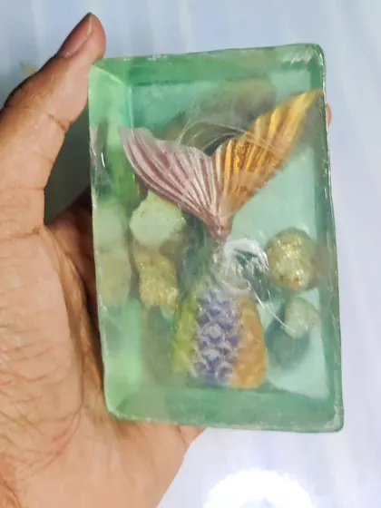 This beautiful mermaid soap was damaged at an exhibit, but it still shows the stunning clarity and design possibilities of transparent soap.