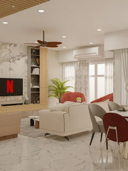 An open-plan living and dining area where a neutral colour palette is accented with pops of deep red for a sophisticated feel.