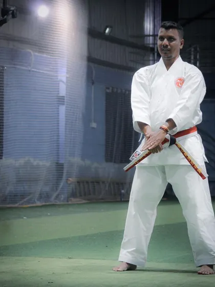As chief instructor, I ensure our weapons training is authentic, safe, and builds true martial arts proficiency, as seen here with the Nunchaku.