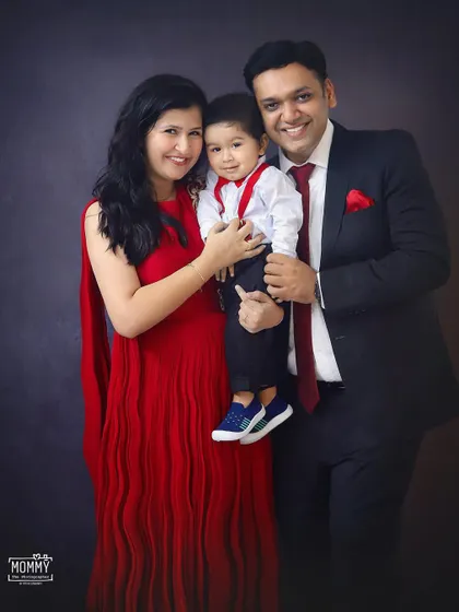 Another beautiful shot of this family, capturing the loving bond between parents and their adorable one-year-old.