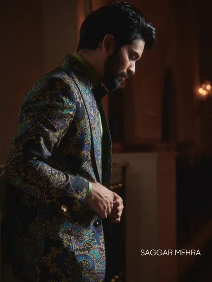 Ankush Bahuguna wears my multi-toned printed jacket, a piece that blends shades of blue, grey, and purple. It's a versatile statement layer designed to transition from casual ease to elevated evenings.