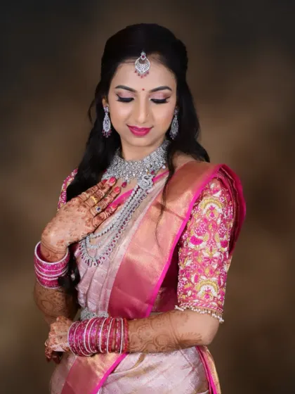 A graceful pose highlighting the beautiful hand-embroidered blouse and the way the makeup tones connect with the outfit.