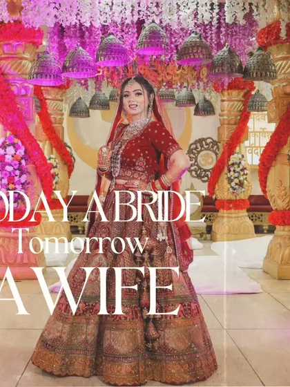 "Today a bride, tomorrow a wife." A full-length shot of the bride, capturing her regal presence and the stunning detail of her wedding lehenga.