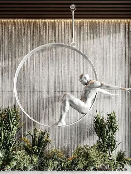 Art meets nature in this unique installation. We integrated a modern sculpture within a bed of lush faux greenery, creating a botanical canvas that is both a garden and an art piece.