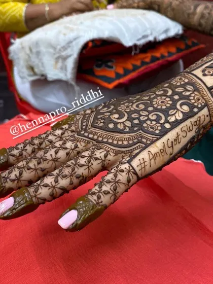 Don't forget the wedding hashtag! I can seamlessly incorporate your unique hashtag into the design, as seen here with the floral back-hand pattern.