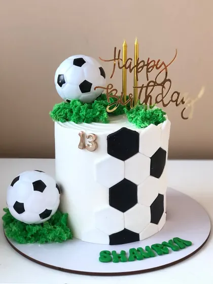 A cool soccer-themed cake with a hexagonal pattern, perfect for a football fan's birthday.