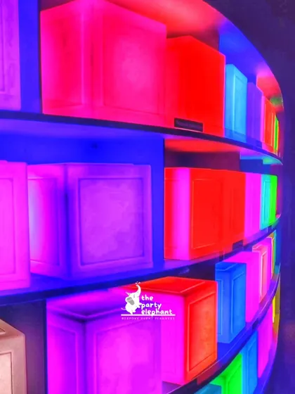 For the neon party, I used these colorful light boxes to create a unique and vibrant wall feature, adding to the glowing, futuristic feel of the event.