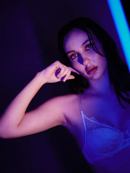 Using a blue light source to create a cool, futuristic feel. The way the light hits the side of her face is beautiful.