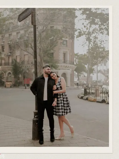 A classic romantic pose on a quiet Mumbai street corner, capturing the timeless feel of the city.