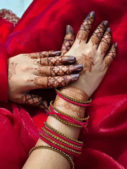 A close-up of the Chhath Puja mehndi, showing the delicate lotus design and the rich colour of the henna stain.