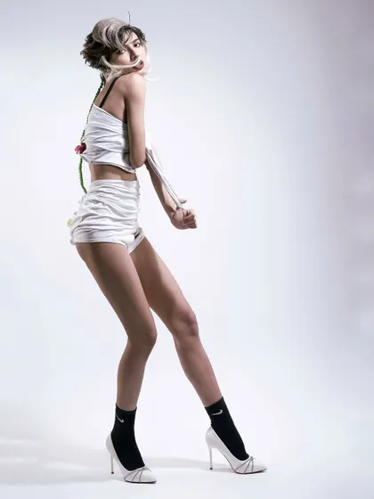 Another pose from the deconstructed series, showing movement and a playful attitude.