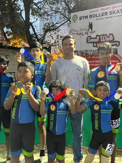 Our skating team proudly displaying their medals with their coach. We provide opportunities for talented athletes from all backgrounds to shine, and these wins are a result of their hard work.