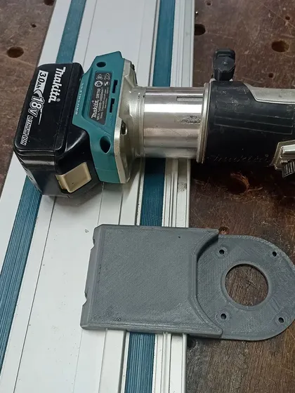 This is a 3D-printed baseplate I designed to adapt my Makita cordless router for use with a guide rail. It's a great example of how modern tech can enhance traditional woodworking.