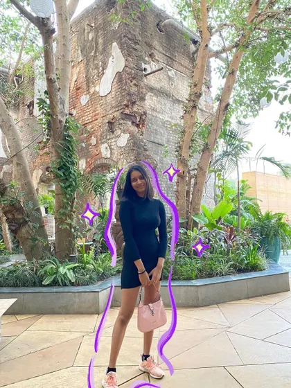 A classic little black dress moment, with a purple outline to add a pop of color.