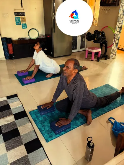 Two of my senior clients work on hip flexibility and strength using yoga blocks for support. My programs for seniors are designed to improve mobility and prevent falls.
