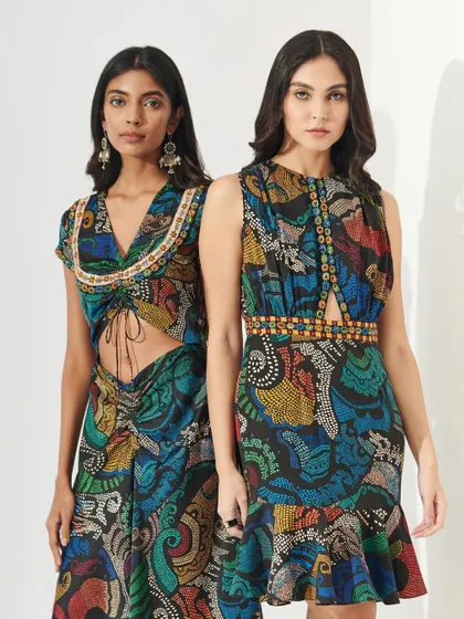 Another dual-model shot for Shopverb. The makeup is fresh and enhances the models' features, aligning with the vibrant and busy prints of the modern ethnic outfits.
