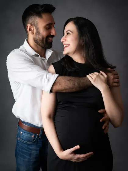A classic couple's portrait in black and white. The shared smiles and loving embrace make this a timeless and romantic shot.