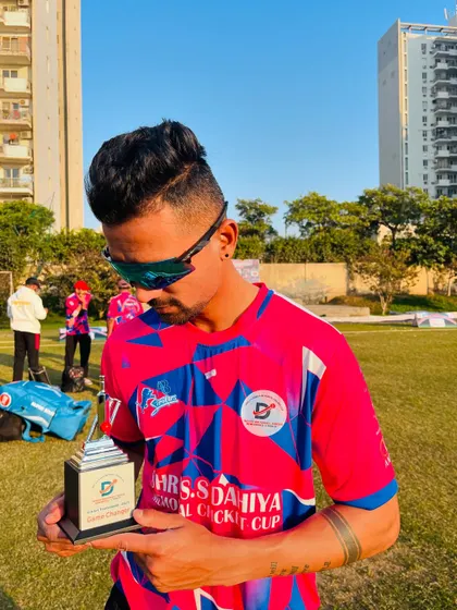 "Be a Game Changer. The world is already full of players." Holding the trophy after a successful match.