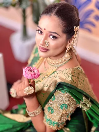 An elegant and royal Marathi bride look. I focus on creating a radiant, long lasting base with soft, shimmering eye makeup that photographs beautifully and lasts through all the ceremonies.