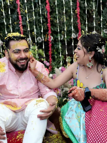 A playful moment between the couple during their Haldi. These are the candid shots I live for, the ones that show the real connection and fun behind the traditions.