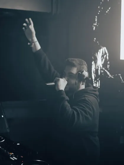 A powerful moment on the mic, commanding the attention of the room.