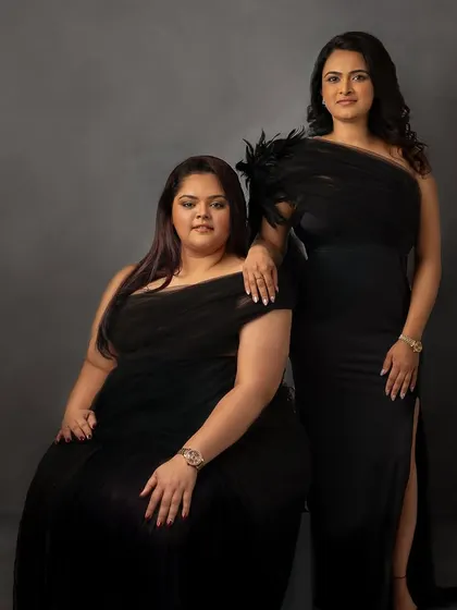 A celebration of friendship in elegant black gowns. This portrait is a beautiful way to honor the special bond between two friends, creating a memory they can share forever.