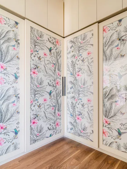 To continue the design story in the master bedroom, we sandwiched wallpaper between glass for these sliding wardrobe doors. It’s a subtle way to incorporate pattern and texture.