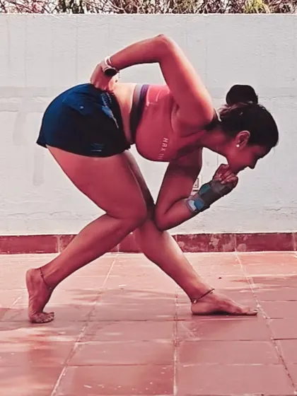 Another angle of the 'Ready Set Let Me Think' pose, showing the deep bind and twist. Poses like these are a fun way to explore the body's potential for movement and flexibility.