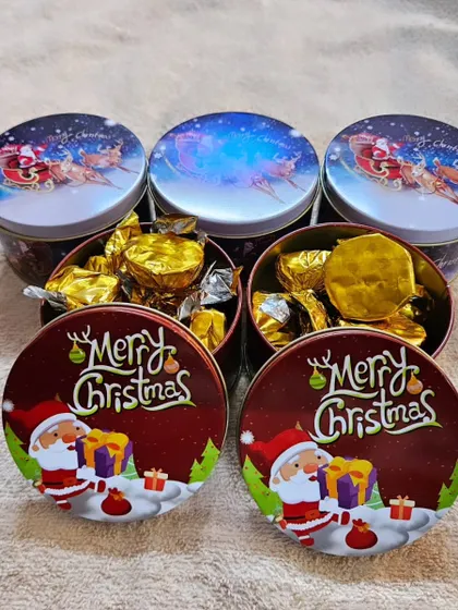 A look inside the Christmas tins, filled with my assorted handmade chocolates. They make for a perfect stocking stuffer or a sweet treat for colleagues.