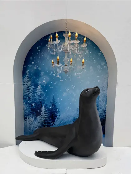 This sleek seal prop, set against a wintery backdrop, adds an element of arctic charm to our winter animal collection.