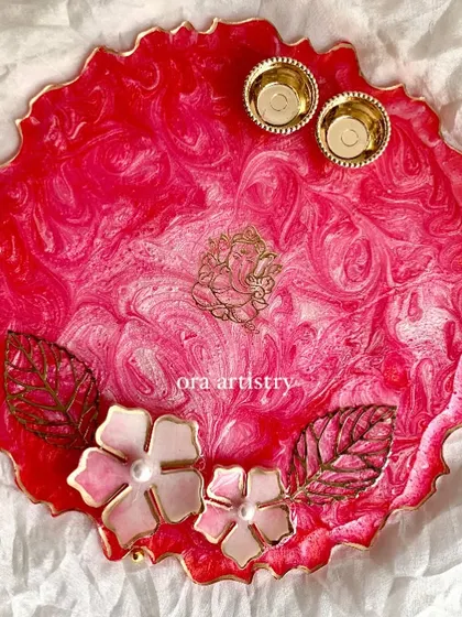 Another view of the pink pooja platter, this time with a Ganesha motif. The 3D flowers and gold accents make it extra special.