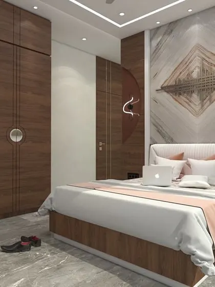 A master bedroom design for a 3BHK in Dadar, featuring rich wood tones and circular motifs on the wardrobe and wall decor. A marble accent wall behind the bed adds a touch of luxury.